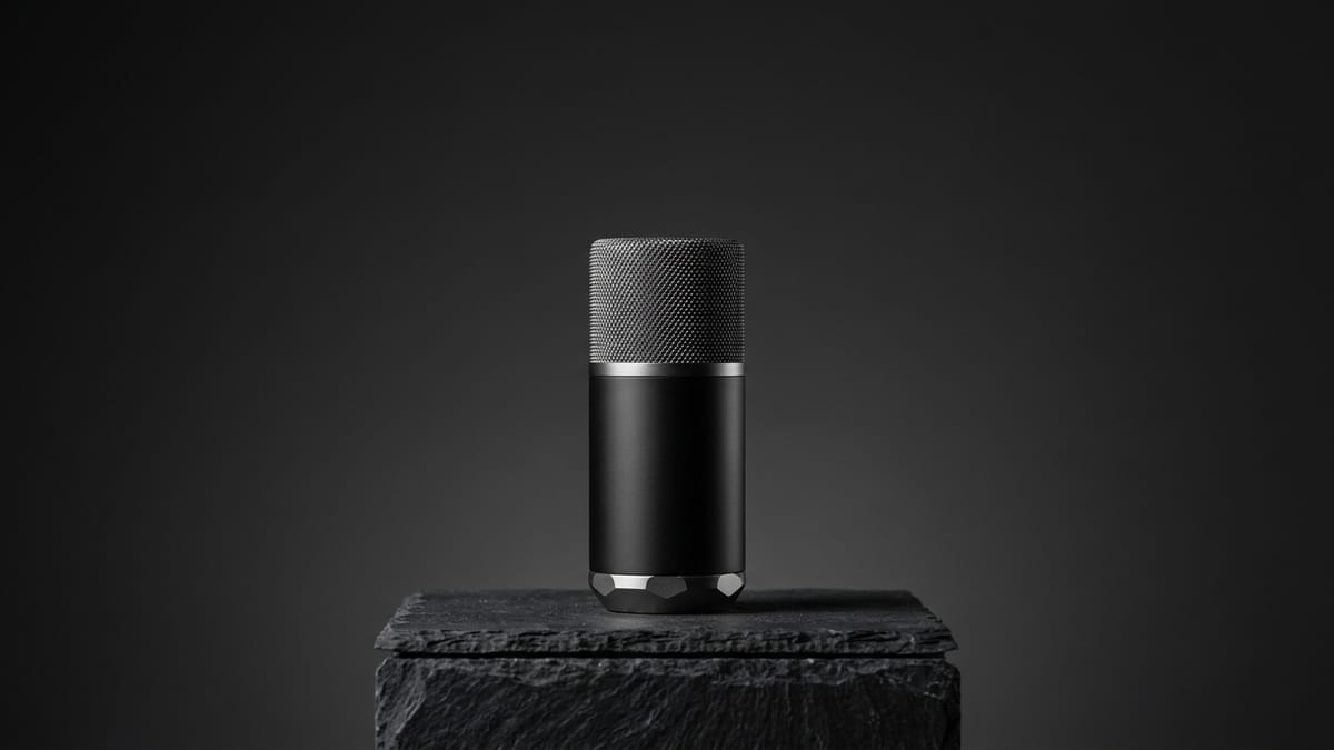 Production directive result showing conference microphone on dark slate pedestal